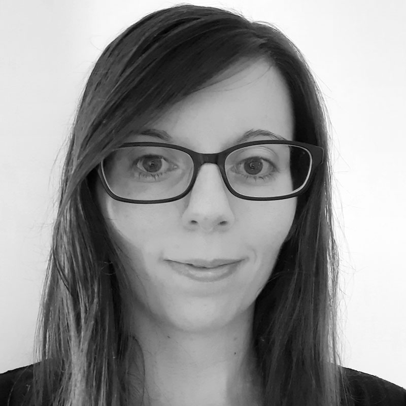 Black-and-white profile photograph of female wearing glasses