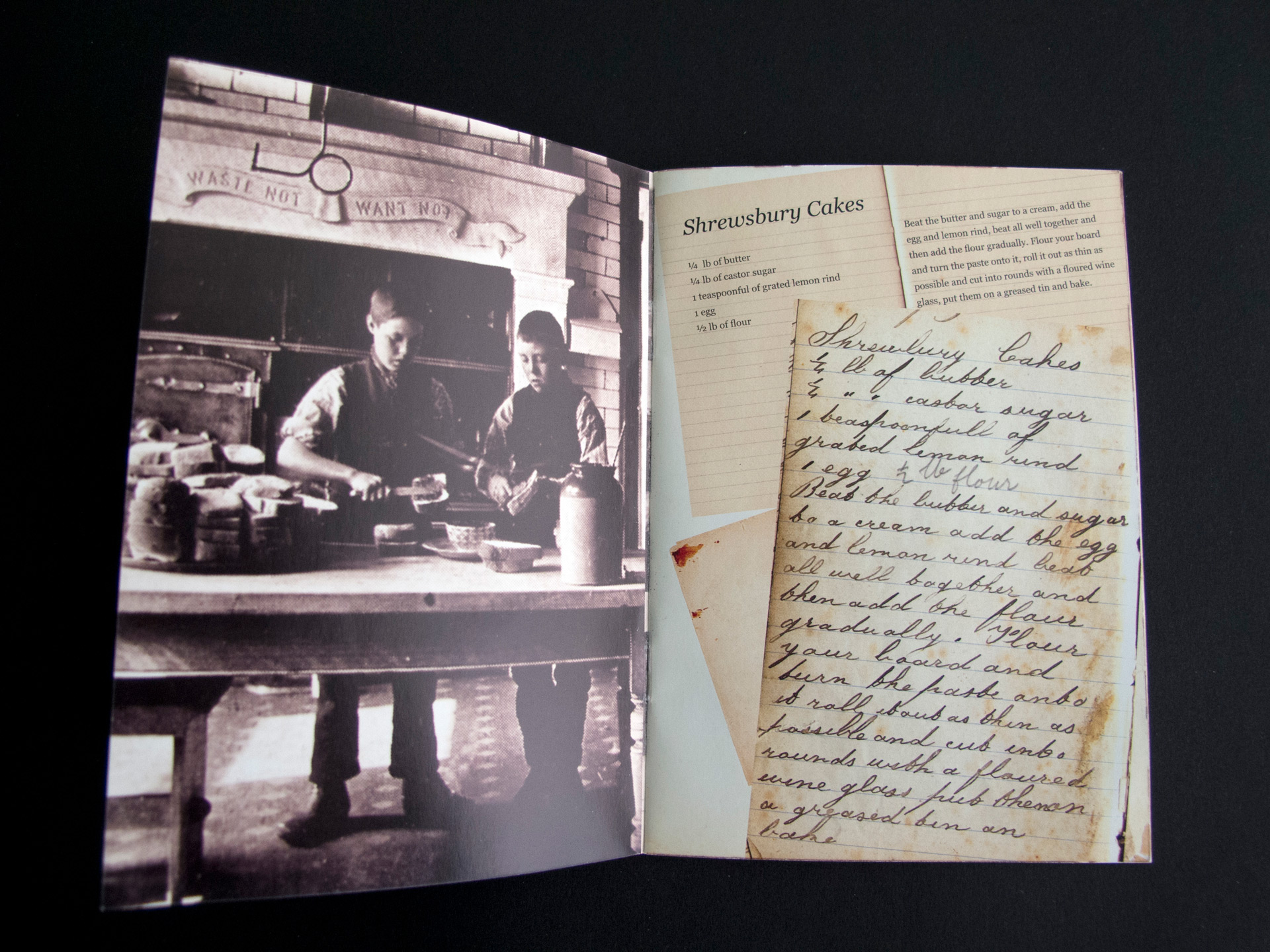 A photo of a double-page spread in the tea room brochure. A black-and-white Victorian photograph of two boys working in a kitchen is on the left-hand page. The right-hand page depicts a collage of lined notepaper and handwritten recipes.