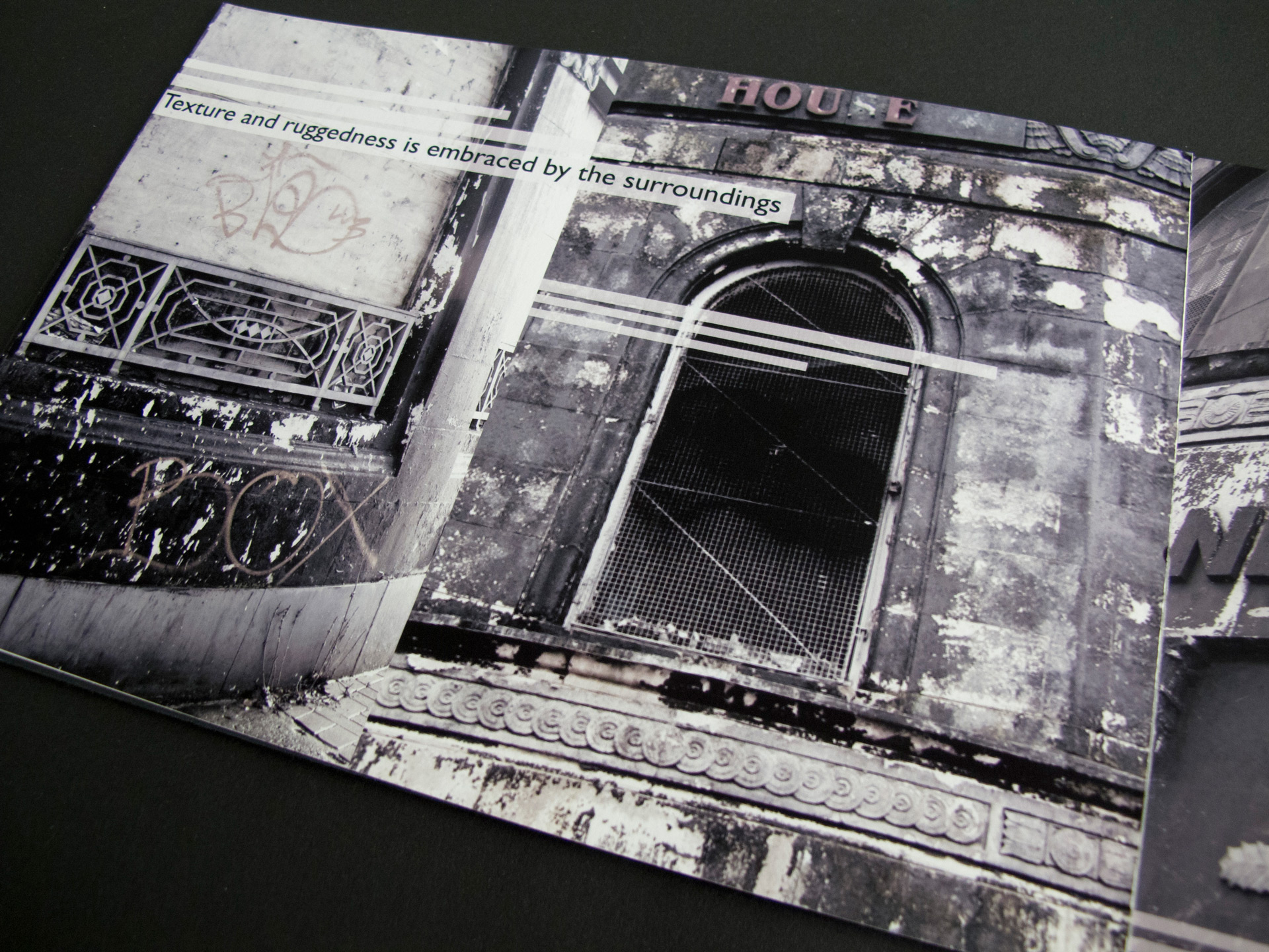 On this page of the booklet, there are two desaturated photographs depicting buildings in a state of disrepair. The images are zoomed in and show worn-out paint and graffiti on the walls. Overlaid on the photograph are the words 'Texture and ruggedness is embraced by the surroundings'.